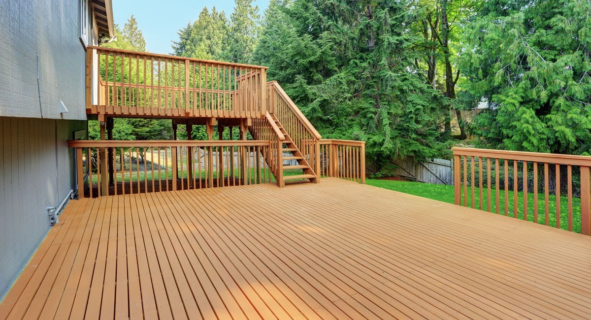 Outdoor deck construction with wood framing