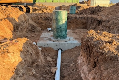 Septic system installation with tank and trenching